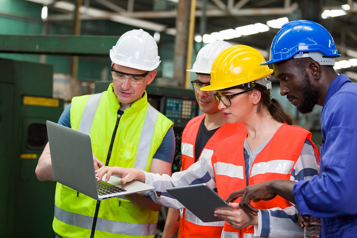 Diversity,Factory,Worker,Working,With,Computer,Laptop,In,Factory.,Male